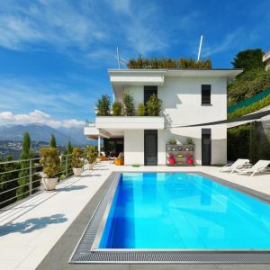 Beautiful,White,House,With,Swimming,Pool,,Summer,Day